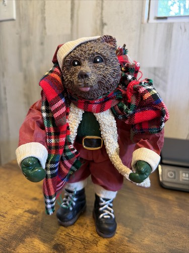 Bear santa claus carrying toy - bear,